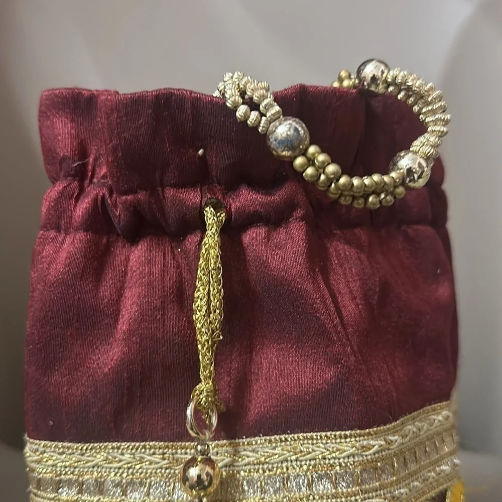Beaded peacock colored jewelry bag